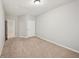 Neutral bedroom with carpeting and a ceiling light ready for your personal touches at 3463 Dunbar Ln, Suwanee, GA 30024