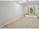 This bedroom features a window seat and plush carpet at 3463 Dunbar Ln, Suwanee, GA 30024