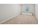 Bright bedroom featuring neutral walls, plush carpeting and a window seat at 3463 Dunbar Ln, Suwanee, GA 30024