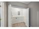 Walk-in closet featuring double doors, built in shelving and carpeting at 3463 Dunbar Ln, Suwanee, GA 30024