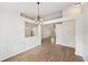 Dining area with modern chandelier, light walls, and open access to the living room at 3463 Dunbar Ln, Suwanee, GA 30024