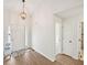 Bright entryway with hardwood floors, chandelier, and access to rooms at 3463 Dunbar Ln, Suwanee, GA 30024