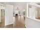 Open-concept living room featuring hardwood floors, fireplace, and natural light at 3463 Dunbar Ln, Suwanee, GA 30024