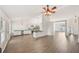Bright, open floor plan with modern kitchen and dining area, featuring hardwood floors at 3463 Dunbar Ln, Suwanee, GA 30024