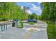 Parking area at Ivy Creek Greenway with available parking spots on a sunny day at 3463 Dunbar Ln, Suwanee, GA 30024