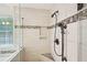 Detail of the luxurious shower showing upgraded shower head, tile, and niche at 3463 Dunbar Ln, Suwanee, GA 30024