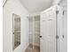 Organized walk-in closet with wire shelving and full length mirror at 3463 Dunbar Ln, Suwanee, GA 30024