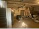 View of unfinished basement with water heater and exposed ductwork at 4865 Surrey Dr, Roswell, GA 30075