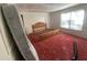 Bedroom with red carpet, window, and bed frame at 4865 Surrey Dr, Roswell, GA 30075
