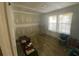 Bedroom shows flooring work in progress with bright, natural light from the window at 4865 Surrey Dr, Roswell, GA 30075