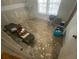 Bedroom shows flooring work in progress with bright, natural light from the window at 4865 Surrey Dr, Roswell, GA 30075