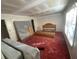 Bedroom with red carpet, window, and bed frame at 4865 Surrey Dr, Roswell, GA 30075