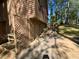 A driveway that leads to a garage with mature trees in the background at 4865 Surrey Dr, Roswell, GA 30075