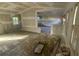 Open living room design with hardwood floors and lots of potential for renovation at 4865 Surrey Dr, Roswell, GA 30075