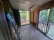 Screened-in porch with a beautiful view of the surrounding nature and ready to be renovated at 4865 Surrey Dr, Roswell, GA 30075
