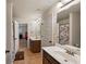 Bathroom with dual sinks, tiled flooring and access to another room at 65 Waters Edge Ln, Covington, GA 30014
