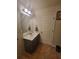 Bathroom featuring a sleek vanity, ample counter space, and modern lighting at 65 Waters Edge Ln, Covington, GA 30014