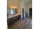 Spacious bathroom features a double sink vanity with modern fixtures and wood-look vinyl flooring at 65 Waters Edge Ln, Covington, GA 30014