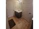 Contemporary bathroom with a double door, vanity, dark cabinets, and tile flooring at 65 Waters Edge Ln, Covington, GA 30014