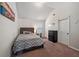 Cozy bedroom with vaulted ceilings, and a window with a bed and dresser at 65 Waters Edge Ln, Covington, GA 30014