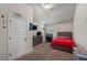 Bright bedroom with a sloped ceiling, desk, television, and natural light at 65 Waters Edge Ln, Covington, GA 30014