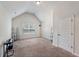 Spacious bonus room with vaulted ceilings and a window for natural light at 65 Waters Edge Ln, Covington, GA 30014