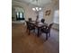 Dining room features a traditional-style dining set and chandelier, creating a sophisticated and inviting ambiance at 65 Waters Edge Ln, Covington, GA 30014
