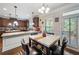 Eat-in kitchen featuring granite countertops, stainless steel appliances and natural lighting at 65 Waters Edge Ln, Covington, GA 30014