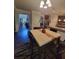 Open-concept eat-in kitchen with granite countertops, stainless appliances, and eat-in breakfast table at 65 Waters Edge Ln, Covington, GA 30014
