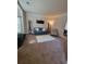 Cozy living room with neutral tones, a plush blue sofa, and a soft white rug at 65 Waters Edge Ln, Covington, GA 30014