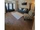 Inviting living room with natural light, an area rug, and elegant decor at 65 Waters Edge Ln, Covington, GA 30014