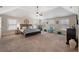 Spacious main bedroom with vaulted ceilings, lots of natural light, and neutral tones at 65 Waters Edge Ln, Covington, GA 30014