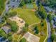 Community aerial view showcasing the playground, baseball field, and walking trails at 111 Springshade Ln, Canton, GA 30114