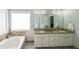 Large bathroom with double vanity, soaking tub, and neutral finishes at 111 Springshade Ln, Canton, GA 30114
