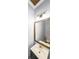 Powder room featuring a vessel sink, framed mirror, and modern lighting at 111 Springshade Ln, Canton, GA 30114