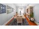 Spacious dining room featuring hardwood floors, a long table, and natural light at 111 Springshade Ln, Canton, GA 30114