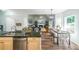 Kitchen and breakfast nook, opening up to living room, with stainless appliances at 111 Springshade Ln, Canton, GA 30114