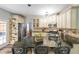 Lovely kitchen featuring an island, breakfast bar, granite countertops and stainless steel appliances at 111 Springshade Ln, Canton, GA 30114
