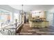 Bright kitchen with a breakfast nook, updated cabinets, and granite countertops at 111 Springshade Ln, Canton, GA 30114