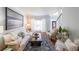 Inviting living room with a cozy sofa, a large window, and stylish decor at 111 Springshade Ln, Canton, GA 30114