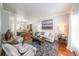Bright and airy living room with hardwood floors, elegant furniture, and large windows at 111 Springshade Ln, Canton, GA 30114
