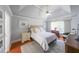 Bright bedroom with tray ceiling, ceiling fan and hardwood flooring at 111 Springshade Ln, Canton, GA 30114