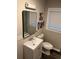 Modern bathroom featuring new vanity, sleek mirror, and fixtures at 2148 Meador Se Ave, Atlanta, GA 30315