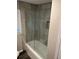 Modern bathroom featuring a glass shower enclosure and neutral tiling at 2148 Meador Se Ave, Atlanta, GA 30315