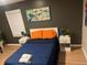 Cozy bedroom featuring a comfortable bed, stylish art, bedside tables, and ample natural light at 2148 Meador Se Ave, Atlanta, GA 30315