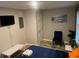 Bedroom features a comfortable bed, TV, chair, neutral walls and a window for natural light at 2148 Meador Se Ave, Atlanta, GA 30315