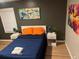 Cozy bedroom featuring a comfortable bed, stylish art, bedside tables, and ample natural light at 2148 Meador Se Ave, Atlanta, GA 30315
