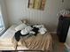 Untidy bedroom with a paneled wall and a dark dresser; needs organizing at 2148 Meador Se Ave, Atlanta, GA 30315