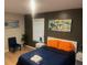 Comfortable bedroom with a queen bed, nightstands, and colorful artwork at 2148 Meador Se Ave, Atlanta, GA 30315