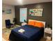 Bedroom features a comfortable bed, chair, and a window for natural light at 2148 Meador Se Ave, Atlanta, GA 30315